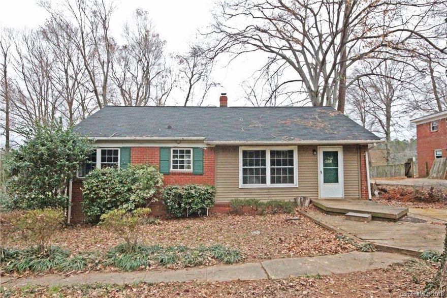 LOCATION, LOCATION, LOCATION!  Renovated houses on this street have gone for over $190k.  This one is a blank slate with good bones:  original hardwoods, 200 amp electrical upgrade, new windows, recent roof.  HUGE crawl space can be used for storage or workshop.  Big partially fenced lot.  Priced below tax value!  Bring your imagination and a tape measure, because at this price this one shouldn’t last long.