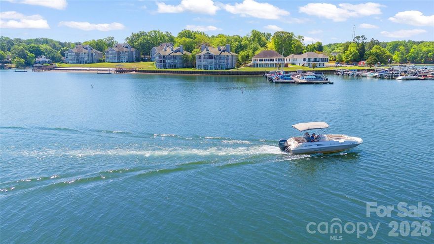 Absolutely breathtaking view from this first floor unit in popular Lake Club at Lake Wylie! Nearly 180 degree views of the lake and all of its beauty from your living room and primary bedroom. End unit, light filled and ready to move right in and enjoy the ease of lake front living at an affordable price. Three bedrooms, three full baths and a great kitchen with abundant light and lake views. Granite countertops, stainless appliances and bar seating plus a dedicated dining area. Beautiful primary bedroom with large ensuite and private enclosed porch, all with lake views. Each bedroom has its own dedicated & updated bathroom. Living area with gas logs, windows galore and an enclosed sunporch just steps from the lake. New HVAC in 2025, renovated baths in 2022. Lake Club amenities include pool, tennis court, playground, firepit, and private beach. Convenient to shopping and convenience of Rock Hill, and only 40 minutes to uptown Charlotte. Start living your vacation life today!!