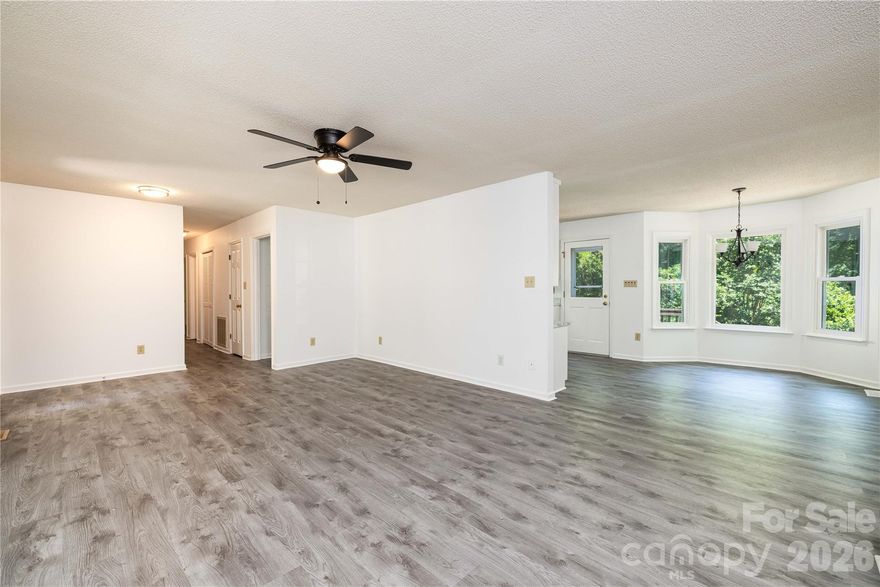 Welcome Home to 21014 Pine Ridge in highly sought after Cornelius location. Established neighborhood home situated on about 1/2 acre.  3-bedroom, 2 bath ranch home. Inside, the home features a bright open living room and sunroom area highlighted by a beautiful brick fireplace, creating a warm and inviting gathering space. The kitchen offers abundant cabinet and counter space along with a spacious pantry, making meal prep and storage easy. The primary bedroom features a large bay window—perfect for creating a cozy sitting area or reading nook. Secondary bedrooms are generously sized and offer flexibility for family, guests, or a home office. The large yard provides the perfect setting for outdoor entertaining, relaxing evenings, or gardening.
Outside, the property includes two powered workshop outbuildings—ideal for hobbies, projects, or additional workspace—plus an extra storage shed. Enjoy quiet mornings on the covered rocking chair front porch or entertain guests on the multiple decks overlooking the private yard.
Conveniently located near shopping, dining, and easy interstate access, this home offers the perfect combination of comfort, space, and location.
Don’t miss the opportunity to make this wonderful property your next home.