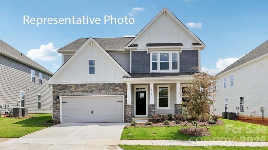 Hampshire plan offers formal dining room open to the butler's pantry and large walk-in pantry closet. The kitchen has an island that has pendant lights with Quartz countertop with subway backsplash. Chef's Kitchen includes gas whirlpool appliance package Stainless includes gas cook top, built in dishwasher, microwave and double wall ovens electric. Living room has a gas fireplace. Main flooring areas has extended Revwood flooring in main areas. First floor ceiling height 9ft with decorative molding two piece crown throughout first floor living area. Breakfast area looks out to the patio through the glass sliding doors. This home has a bedroom on the main level off the living room and steps away from the full bath down from the entry to the garage. The stairs are off the kitchen with open rails . Upstairs offers an open loft area off the primary suite with tray ceiling and sitting room with a spacious walk in closet.