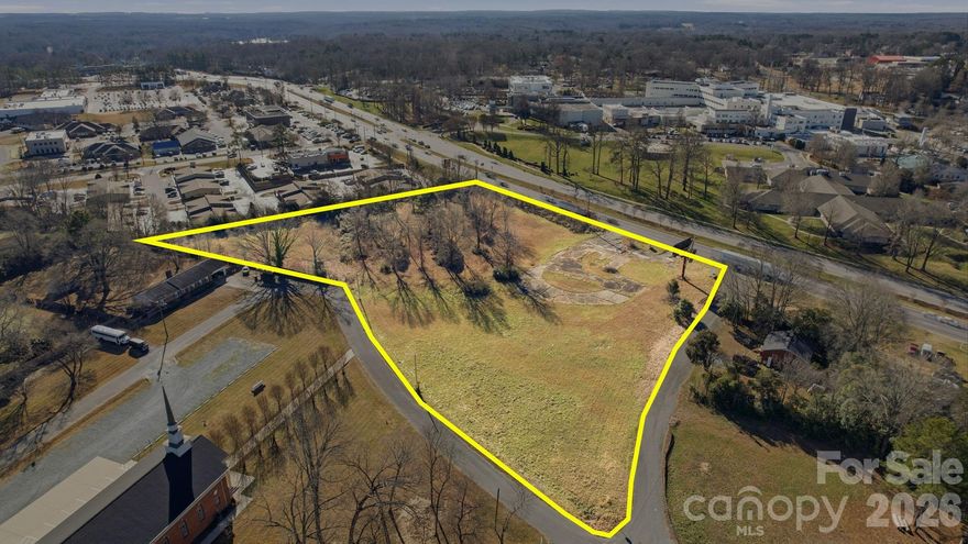 Prime 4.40-acre commercial lot on Hwy 74 / E Roosevelt Blvd in Monroe, NC, with high visibility. Close to Atrium Health Union West, retail centers, and other commercial developments. General Business zoning allows for a variety of uses. Billboard on site. No building on the property. Utilities nearby.