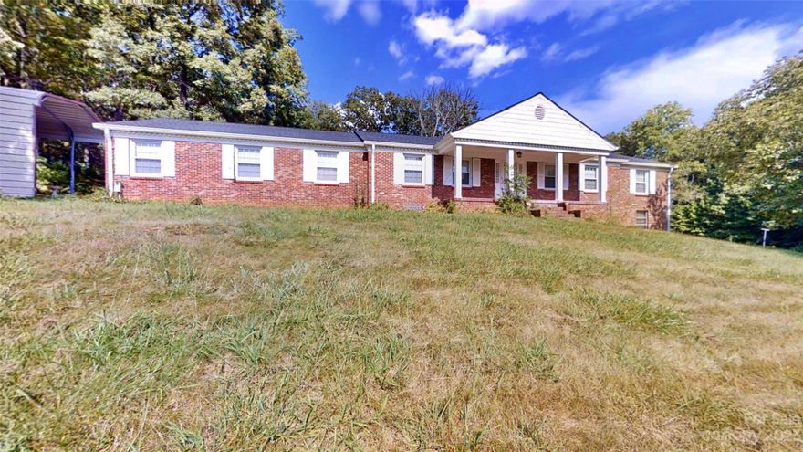 25+ acres of buildable land with 5 existing houses in highly desirable Haw Creek! This sought-after estate property features wooded and cleared areas with gentle rolling slopes: hard to find in Asheville these days and very rare in Haw Creek! Taking offers until close of business Friday 8/11/23. Developers: take a look at nearby Trapper's Run and Huntington Chase and long-established Happy Valley as examples of subdivision potential. 5 single family houses have been maintained through the years including roofing, newer plumbing and circuit-breaker panel boxes. Separate 2-bay mechanic's shop features tall bay doors and separate electricity service. Separate, individual storage shed for each house. Zoned RS4. See flood area maps for non-encroach area near New Haw Creek Rd. Please no drive-by's: do not disturb renters. Buyer to confirm all facts as seller is executor of estate, has extremely limited knowledge of the property and has not occupied the property. See residential 4054085