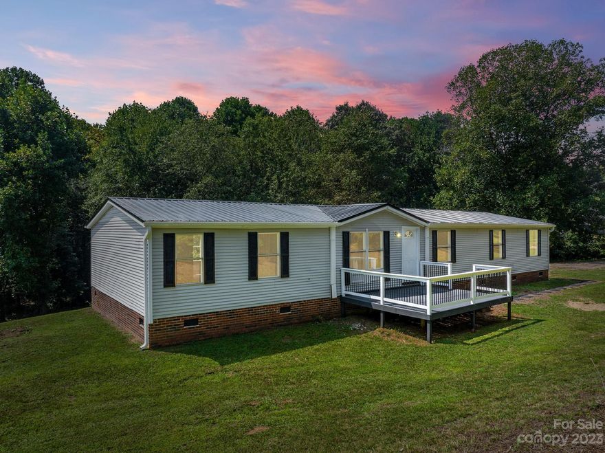 $4,000 in Seller paid Closing Cost AND Home Warranty included!! Large newly updated 4 Br 2 BA home located on 2 acers.  The inside of the home offers a spacious open floor plan.  The primary suite features a large main room, a secondary area that could be used as an office or nursery, already has a large walk in closet and full bath.  Both full baths showcase stone top vanity cabinets.   The living room, kitchen and large dining area are open concept. This home utilizes a split bedroom arrangement. The additional 3 Bedrooms are nice and roomy as well.  You are surrounded by trees so enjoy the peace and quite from either of your two decks. A creek lines the property. Whether you are looking for a bit of privacy that is also close to town or maybe a  place for a nice garden with room for small farm animals.  This could be exactly what you are looking for.