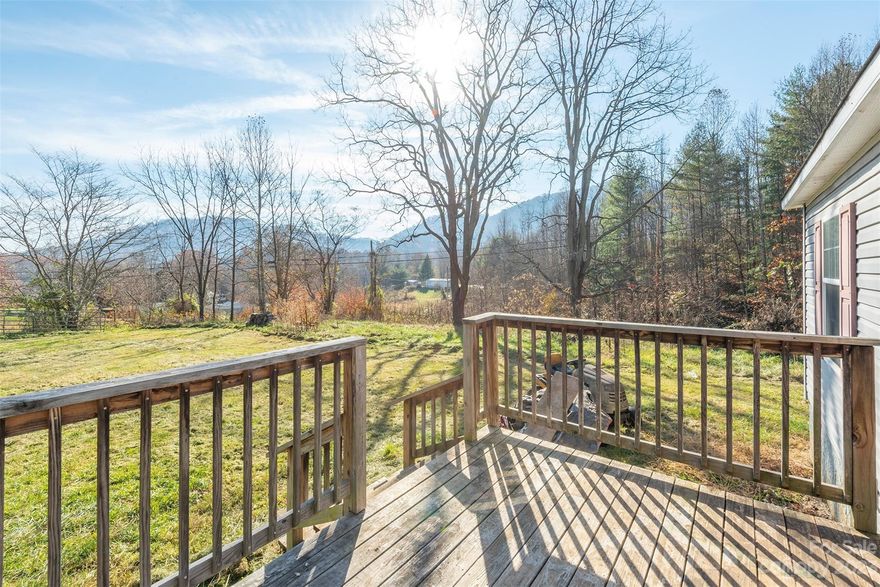 Mountain Retreat on 3.4 Acres in Clyde, NC - Priced to Sell Quickly! This hidden gem is tucked away in the serene community of Clyde, where small-town charm meets the majestic beauty of the surrounding mountains. A unique blend of tranquility, opportunity, and affordability. Nestled among the rolling hills, just minutes from the picturesque towns of Waynesville and Clyde. A huge covered building foundation awaits your creativity, your future dream home, a spacious barn, or a versatile workshop? Plenty of living space and a cozy woodstove inside. Step outside, is a world of natural wonders at your doorstep.  With this much land, your possibilities are virtually limitless. This property is priced to sell quickly, offering a unique chance to embrace mountain living without breaking the bank. With your vision and a little TLC, you can transform this into the mountain retreat you've always dreamed of, all while enjoying the peaceful lifestyle that Clyde offers. Home sold "as is"