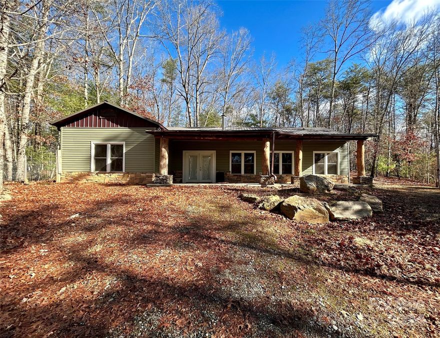 Welcome home to your private retreat in the woods! This home is tucked away in Lenoir and sits on top of a gently sloping hill. The house boasts open concept living & eat in kitchen area with a wood stove to keep it cozy. Concrete flooring throughout gives this "cabin like" home a contemporary feel. With 3 bedrooms, 2 baths, and a bonus space perfect for an office, this home has everything you need. Plus a fenced in yard that is perfect for your animals to run in! Seller wishes to sell "As-Is."