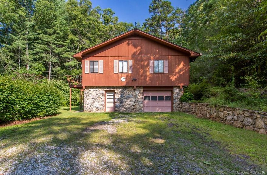 Large home for family about 18 minutes from Asheville , 2.35 acres that ajoins Woodland Hills.  It's not under Woodland Hills C & R, It's a great lot with privacy and without restrictions.  Over 3,000 sqft of space for under 300,000, hard to find close to Asheville.    HOME BEING SOLD AS IS , BUT OWNER KNOWS THAT THE HOME NEEDS UPDATING AND WILL LOOK AT ANY AND ALL OFFERS !!