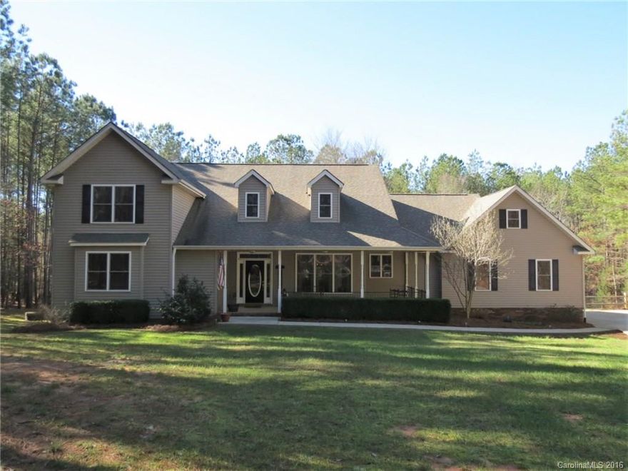 This beautiful home with an in-ground pool & screened porch is nestled privately on a 2+ acre wooded lot in a great location. The interior features an open, split-bedroom floor-plan that is warm and welcoming. The master BR & BR2 are located on the main level & BR3, BR4 and finished bonus on the upper level. Kitchen features a double oven, island & granite counters. Covered front & back porch are ideal for relaxing & entertaining. Easy access to Lake Wylie boat ramp, shopping and Clover Schools!