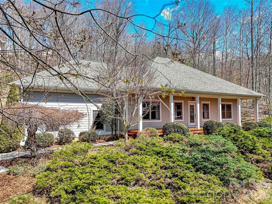 Back on the Market, no fault of the home or sellers. Elevation meets elegance in this custom-designed, one-level contemporary retreat. Perched at 3,400 feet in the serene Shadow Woods community, this 3-bedroom, 2-bathroom sanctuary spans 1,975 sq. ft. on a private 1.18-acre lot.

The heart of the home is a breathtaking Great Room, where soaring vaulted wood ceilings and matching wood accents meet gleaming hardwood floors and a cozy gas-log fireplace. The gourmet kitchen is a chef’s dream, featuring quartz countertops, updated appliances, a pantry, and a breakfast bar that flows effortlessly into the informal dining area.

The thoughtful split-bedroom floor plan ensures a private primary suite, boasting a walk-in closet and a spa-like bath complete with radiant floor heating, a soaking tub, and a shower. Enjoy your morning coffee on the rocking-chair front porch while taking in the long-range mountain and winter views, or retreat to the large screened-in back porch for private, wooded relaxation.

Enjoy the very best of mountain living without the stress of upkeep. This Waynesville gem has been thoughtfully updated from top to bottom, including a new roof, gutter guards, and quartz counters (2025), a refreshed back deck (2026), and a HVAC propane furnace system and appliances (2022). Tucked away in a quiet "silent zone" but close enough to hear the heartbeat of downtown, it’s a rare find that offers both tranquility and total peace of mind.