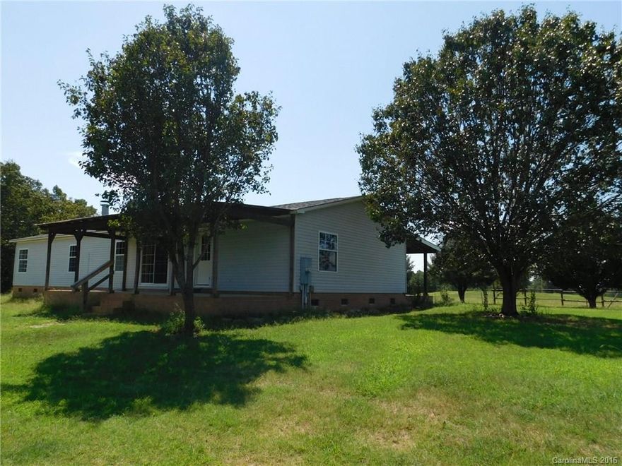 PRICE JUST REDUCED $10,000.  Secluded 10 acres of FENCED farm/pasture land.  3 bedroom 2 bath home with fireplace, covered front and back porches with a covered carport. Perfect horse property and would be great for additional animals.  The barn is over 1000 square feet perfect for hay and other farming supplies.  Well placed farm in Union county with gorgeous views. Serene and peaceful setting.  You are welcome to drive by or call the listing agent for additional information.