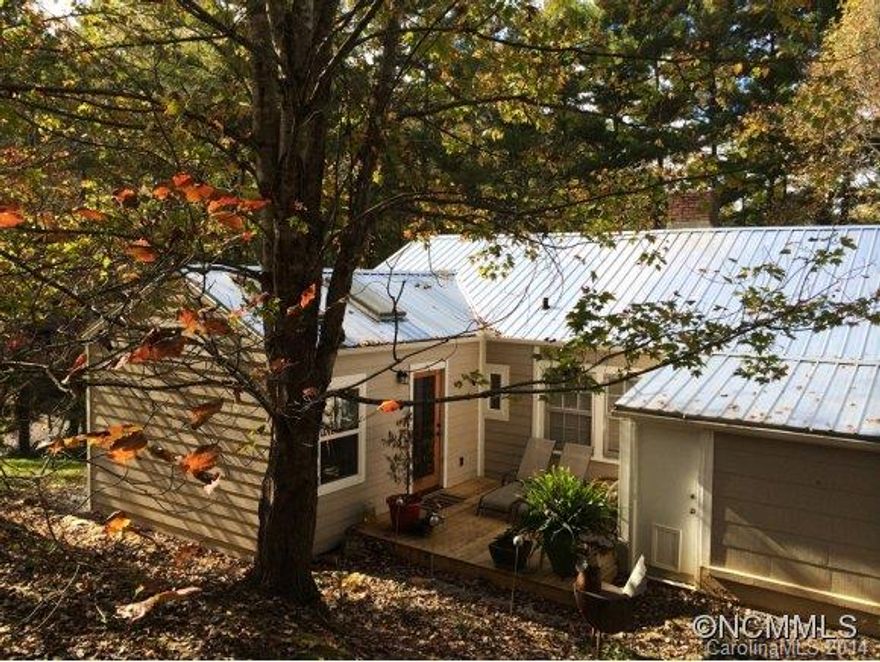 Beautiful home in desirable Beaverdam Area! Numerous recent upgrades include the addition of a Master Suite, Master Bathroom and private patio off Master Suite. New Tin Roof and heating/cooling system. Come experience this comfy home on almost an acre of wooded and private land. Features include antique beams, barn wood, stone fireplace, hardwood floors, vintage Chambers stove, recent exterior painting and an overall vintage feeling! Sold as is.