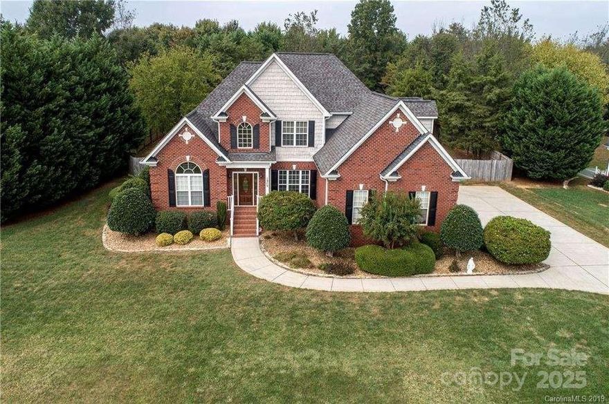 A must see!! Rare find in Monroe, full brick on over an acre lot close to Dining and Shopping. Some features of this well maintained home are an Open Floorplan, 2 Story Great room, First floor Master Suite w/sitting room, walk-in closet and garden tub. Hardwoods on the Main Floor. Gourmet kitchen with 42" cabinets, Granite countertops, Gas Range w/Convection Oven and Tile backsplash. 2 bedrooms upstairs with walk-in closets Large bonus room with Pool Table and built in Mini Fridge. Large Screened in patio w/stamped concrete and TV. Beautiful landscaped front yard with irrigation and outdoor lighting. Fully fenced backyard with gas grill and large garden. Also Washer/Dryer will stay. Hurray, this beautiful home will not last long!!