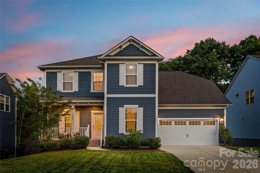 A rare find, this McCullough home with a basement backs to a stunning wooded view, and just a couple houses down from one of the community pools! From the moment you enter the covered front porch, you'll notice the fresh paint throughout the entire home, and luxury vinyl plank flooring that runs on the entire main level. You are flanked by a dining room with a tray ceiling and an office with french door. A butlers pantry with space for a beverage refrigerator gives way to a chef's kitchen, with all the details - expansive quartz counters, gas range with stainless steel hood, large walk-in pantry, backsplash to the ceiling, and more! The breakfast area opens to a deck, perfect for grilling or enjoying the treed backdrop. The great room is centered by a cozy gas fireplace with stacked stone details. You'll also find a flex space off the garage, ideal for a drop zone station, additional office or workspace, and extra storage. As you head upstairs you'll find a generous primary suite with a large walk-in closet, and a bathroom with dual vanities, a walk-in shower with a rainfall shower head, a bench, and tile to the ceiling. Another 3 bedrooms, a full bathroom, a laundry room, a large loft space, and walk-in attic storage round out the upstairs. Head to the basement and you'll be amazed with all of the extra space—an expansive recreation room for multi-use, a full bathroom, and tons and tons of unfinished storage areas! As you head outside onto the lower level patio, you'll find a peaceful backyard with this exterior facing lot - plus full irrigation for easy maintenance. And don't miss the amenities - McCullough is a lifestyle rich community with 2 pools (one just 2 lots down), sport courts, a dog park, many open green spaces, near downtown Pineville with a new greenway access trail - welcome home!