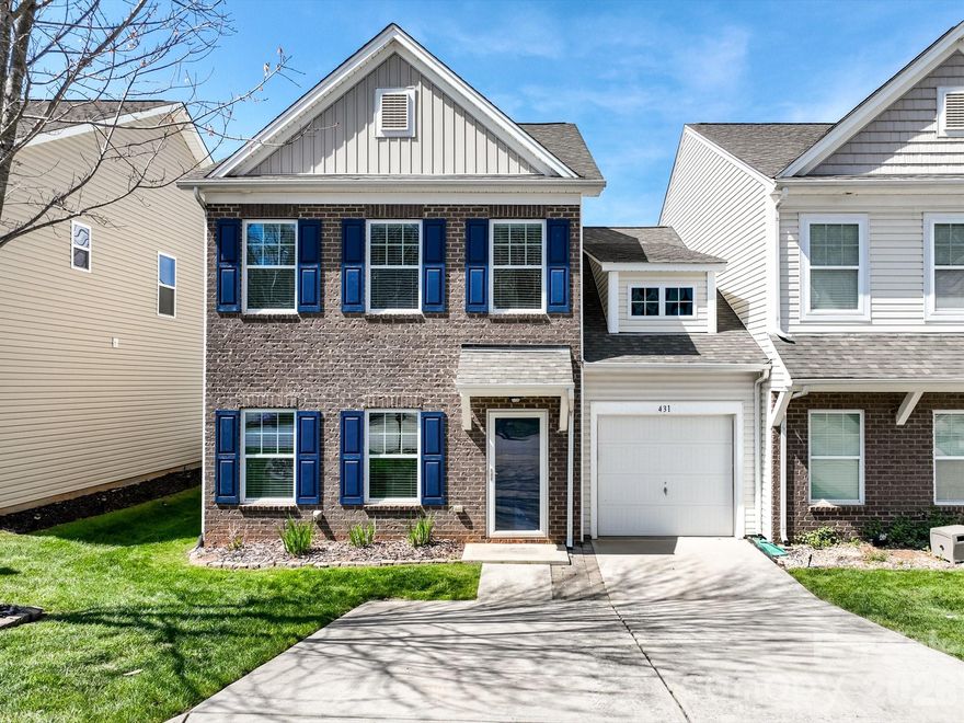 Discover the perfect balance of elegance and effortless living at 431 Battery Circle. Situated in the gated Harpers Green community, this rare end-unit townhome offers a serene backdrop of quiet green space and the privacy of a fenced-in backyard.

Step inside to a bright, open-concept interior featuring gleaming hardwood floors and premium finishes throughout. The chef-inspired kitchen is a showstopper, boasting granite countertops, designer cabinetry, and stainless steel appliances. Designed for longevity and convenience, the primary suite is located on the main level, providing a spacious and private getaway without the need for stairs.

Peace of mind comes standard here, with a new HVAC system installed in 2023, ensuring energy efficiency and comfort for years to come. The second level expands your living options with a versatile loft, ideal for a home office or library, and two additional bedrooms. Storage enthusiasts will love the expansive unfinished walk-in room upstairs, offering the rare "attic-style" capacity that townhome living often lacks.

Enjoy a true lock-and-leave lifestyle in a managed community, just moments from local dining, shopping, and the recreational lifestyle of Lake Wylie.