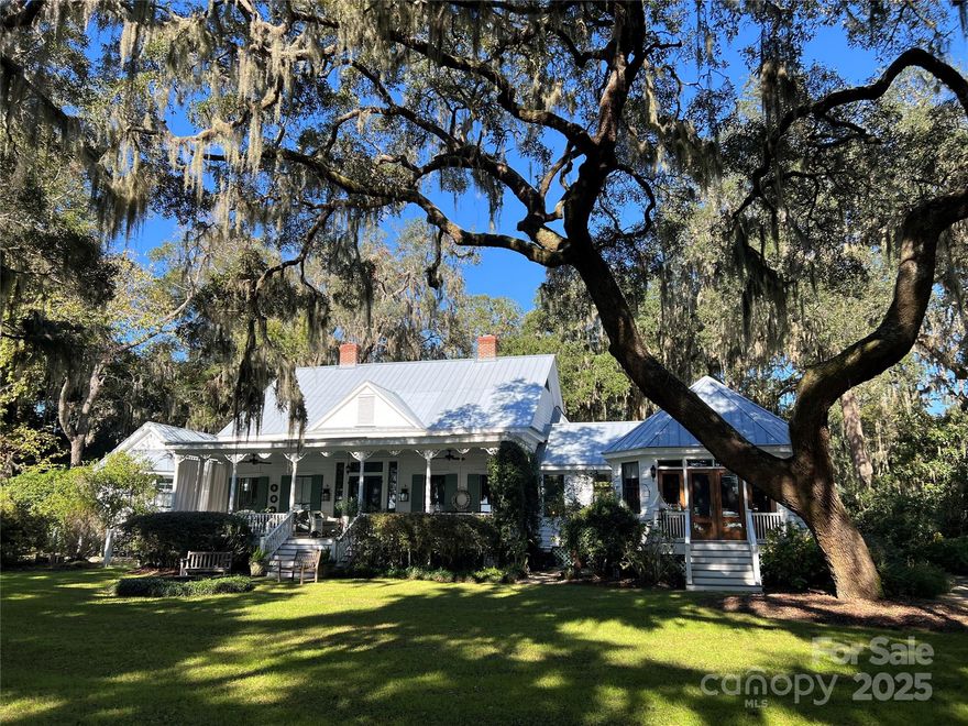 Back on market at no fault of seller or home. The Pritchard House, ca. 1890 located in the historic riverside district of charming downtown Bluffton, SC. Surrounded by extensive landscaping & nestled under 12 Live Oaks is a main residence & guest cottage. Overlooking the May River & sought after sunsets, enjoy the low country lifestyle in what is one of Bluffton's finest treasures. Renovated in the 1990's with 2 winged additions, one the primary suite & one the kitchen/dining/sitting area. Guests are welcomed by the large porch & grand hall/foyer which was originally the living/dining area.  Sightlines to the large front yard & river beyond. Upgrades/dates over the years include new Viking appliances, kitchen mahogany front doors, laundry room & mud room herringbone brick floor. Guests staying in the 2 bedroom cottage can enjoy fishing, bird/dolphin watching on the river or strolling through the flower gardens. Extensive brochure & video available. Bedroom 3 does not have a closet.