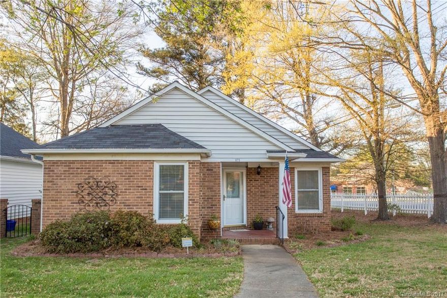 What an adorable home!!!  Walk into beautiful brand new hardwood floors throughout the main area of the home. Large master bedroom with sitting area leading out to the screened in porch, large walk in closet with a remolded master bath. Main area has a large family room with two sliding glass doors, Dining room, eat in kitchen,kitchen pantry, laundry closet, and another remolded bath. Enjoy spending time on the beautiful patio with this low maintenance home.