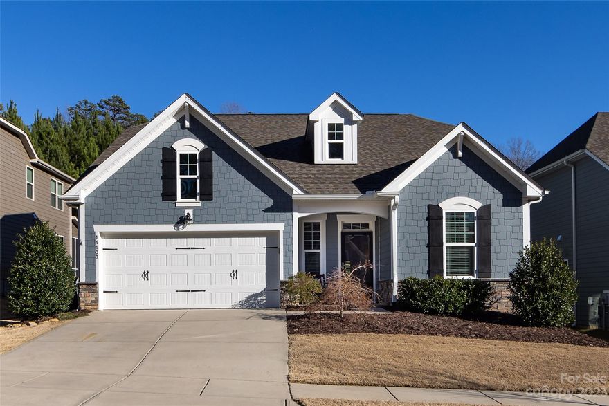 PRICE IMPROVEMENT! Immaculate North Reach home with a substantial amount of neighborhood amenities. This meticulously maintained house features three spacious main level bedrooms, wainscoting and crown molding, hardwood floors throughout the main living area and an open floor plan. The home showcases a large kitchen with an oversized island, granite countertops, 42” cabinets, a gas range, and upgraded appliances. The main level owner's suite features a tray ceiling, primary bath with separate vanities, a large tiled shower, and a desirable closet with additional storage cabinets. Custom cabinets are displayed in the laundry room and a convenient drop zone greets you at the garage entry. Upstairs you will find an oversized bonus/flex space with massive walk-in storage that can easily be finished for additional heated living area. The rear covered patio overlooks a fenced-in and well maintained yard and backs up to HOA common area.