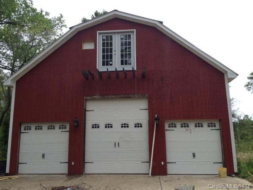 Beautiful piece of property with an awesome 6 car  barn or park your traveling RV.  Well and septic for approximately 3 bedroom home.   Great spot in the country for privacy and convenient to the city.   I-77 approx. 4 min. away.  Ready for the home of your choice ... all information deemed reliable but not guaranteed