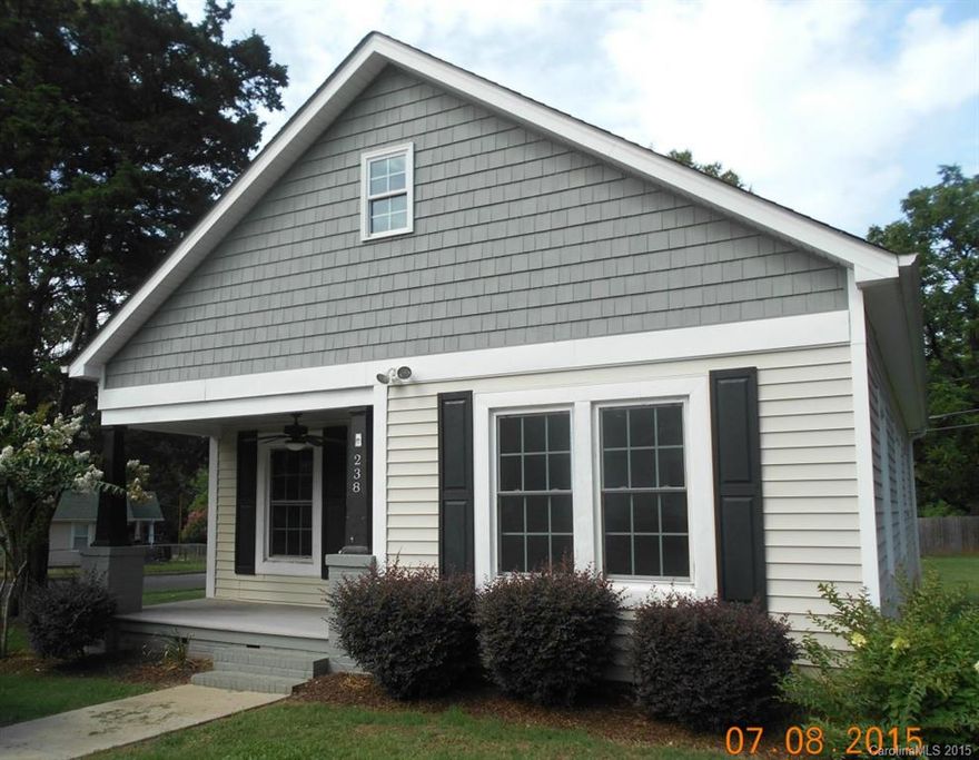 Beautiful bungalow with covered front porch in historical neighborhood near downtown Fort Mill.  Everything redone. Restored to better than original charm. Attic space finished with additional bedroom and full bath. Roof, HVAC,windows and doors, floor coverings, bathroom and kitchen fixtures have all been replaced since 2010. Laminate floors, ceramic tiles, crown moldings, light fixtures and ceiling fans all added. Charming street in a Fort Mill village.