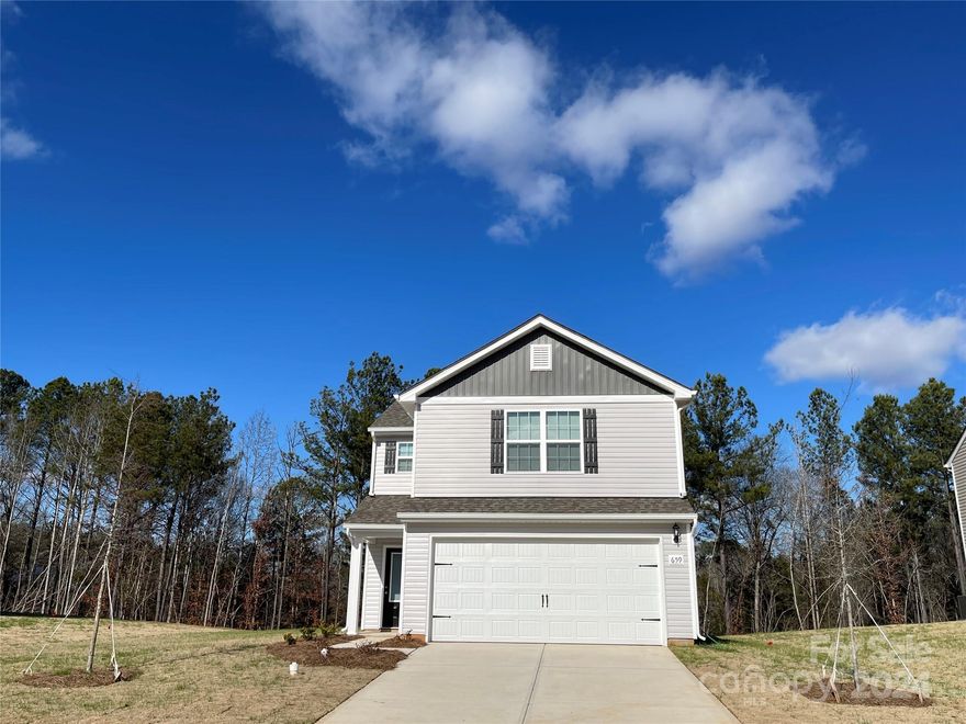 This new home sites on a wide lot with plenty of trees in the backyard.  You won't feel cramped especially when you open the front door and walk into the beautiful open floor plan.  Spacious rooms to spread out and relax in.  The chef ready kitchen is complete with granite counter tops, Whirlpool brand stainless steel appliances which includes refrigerator, dishwasher, oven and microwave.  Upstairs are 3 spacious bedrooms and great closets and 2 bathrooms with plenty of storage space.  The beautiful primary suite has a soaring vaulted ceiling, private bathroom and large walk-in closet.   Enjoy our neighborhood park and let your pets play at the dog park.