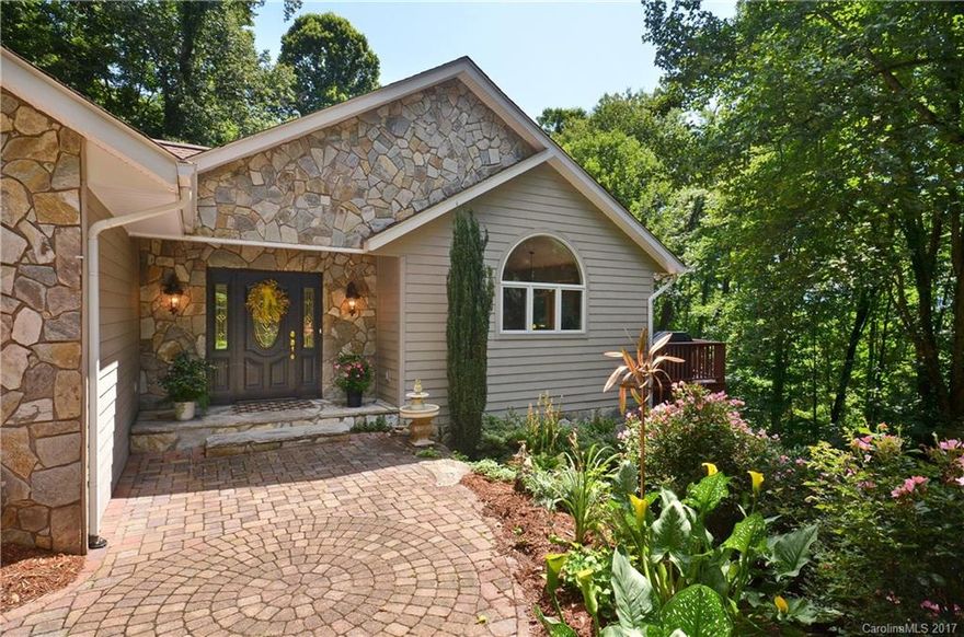 Driving through the Stone Gated private entrance, passing an active Creek, you have just entered your own 2.4ac Mountain Sanctuary! Located in Laurel Ridge CC & minutes to downtown Waynesville. Remarkable "turn key" mtn home features 3 Bdrms/2.5 Baths,Stone FP, lg covered deck, Granite Kitchen, Formal Dining, Vaulted Great Rm, Hardwood Flrs & lg Mastersuite w/ lg walk in closet & granite bath.  Meticulously maintained & professionally landscaped. Savor nature in this beautiful, private setting!