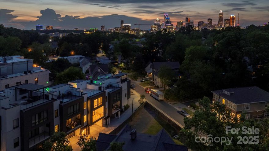 Welcome to this stunning modern townhome located in the highly sought-after Myers Park area. This beautifully crafted residence, part of an elite five-unit enclave by Chiott Custom Homes, is just steps from shopping, dining, and the Little Sugar Creek Greenway. The townhome offers a private 2-car garage leading to a shiplap-accented drop zone, flex guest room/office with an en-suite bath, and access to a serene outdoor space. The main level is designed for entertaining, featuring a light-filled, open floor plan, a chef’s kitchen with Sub-Zero and Wolf appliances, and a large working island that connects to the dining area and family room. Enjoy a cozy covered balcony with views of Queens Road or unwind in your private planning office. The upper level includes a luxurious primary suite with a spa-like bath, two guest rooms, a full bath, and a laundry room. Take the elevator to the rooftop terrace and enjoy panoramic views of the Queen City skyline-perfect for hosting gatherings!