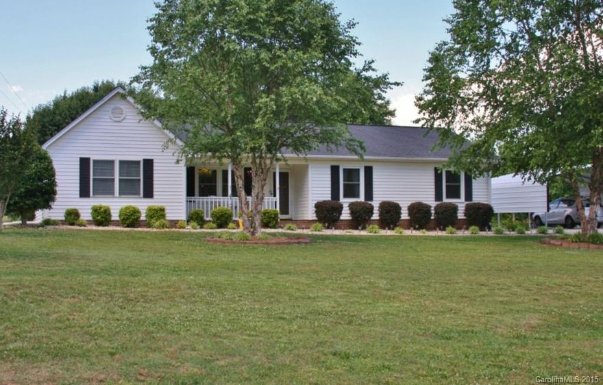 4 bedroom, 2 full updated baths on nice 1 acre lot. Home has been updated with new paint, floor covering and vinyl tilt windows. Bathrooms have ceramic tile with new vanities, shower doors and mirrors. Large living room with ventless gas logs and French doors that lead to large patio area. Large pantry. Rocking chair front porch. 12’x14’ detached, wired building with loft storage. No HOA fees. Clover Schools.