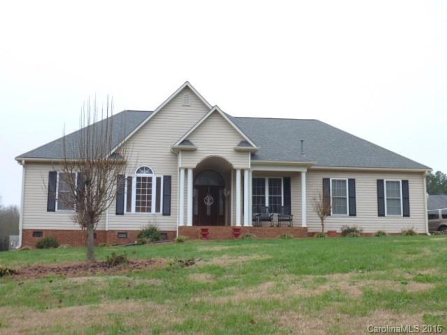 Gorgeous Custom Built 3BR, 2.5BA, located North side of town on 2 acres. Home features, living room, dining room, kitchen with breakfast area, MBR suite has fireplace, MBA has dbl vanities, water closet, walk-in closets, 3 car attached garage, also 3 bay detached garage/shop,  new deck, freshly painted, new appliances in kitchen. A Must See!