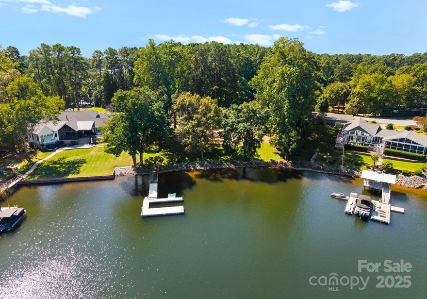 A rare chance to design your dream lakefront retreat on one of the most coveted stretches of Lake Norman. Just beyond The Point, this homesite offers the ideal canvas for your vision—whether it’s a sleek modern estate, a timeless craftsman, or a weekend escape. Picture yourself relaxing on your private pier overlooking deep, year-round water. This property checks every box for lakefront living: a prime location with easy access to dining, shopping, entertainment, and more. With no HOA, yet the option to join The Point and enjoy its world-class amenities, the possibilities are endless. Comprehensive property details—septic and survey information—are provided. Back on the market at no fault of the seller. Please call agent for information.