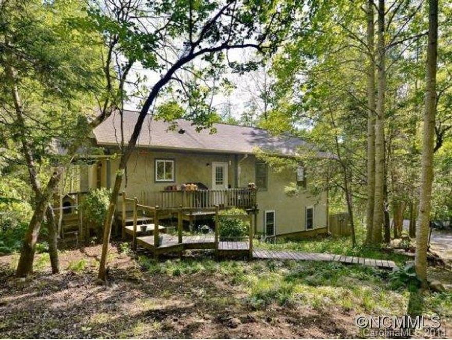 Private retreat near watershed. Cozy three bedroom, two bath cottage with front and rear decks. Wired for cable, broadband, and VOIP telephone. Lower level finished in 2008 with floor radiant heat in bath. 20 ft X 32 ft Barn with concrete floors and electricity for studio or workshop. Custom cabinets in kitchen, appliances included. Perfect for second home, private getaway or first time home buyer.