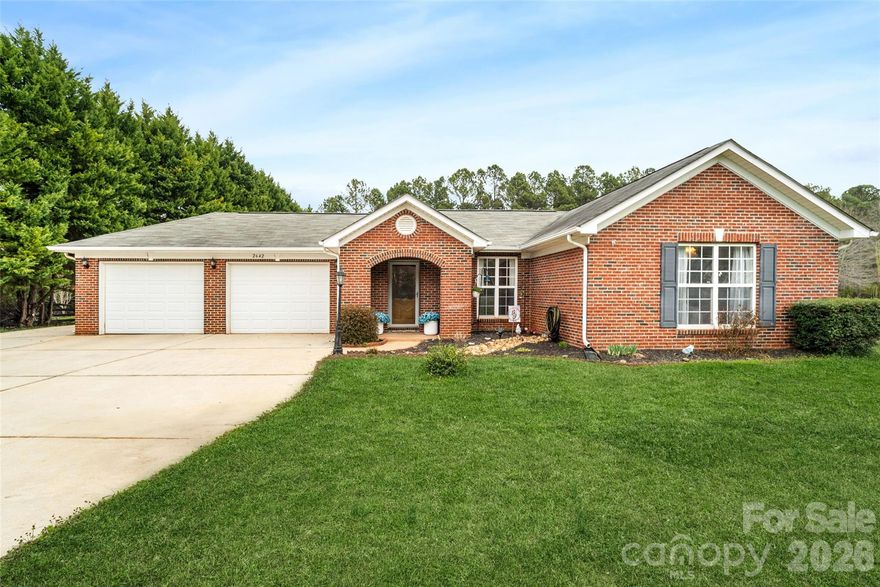 Move-in ready ranch on 1.15 level acres with scenic backyard views and NO HOA or city taxes! This well-maintained property features an open floorplan with vaulted great room, cozy woodburning fireplace, and versatile sunroom/flex space with separate backyard entrance. Rare 5-car garage setup includes an oversized 25’ x 26’ attached garage and a 20’ x 24’ 3-car detached garage (built 2017), plus a workshop and shed, with a partially fenced backyard offering added flexibility. Private primary suite features multiple closets and a walk-in shower. Updated hall bath includes a garden tub with tile surround to the ceiling. Laminate wood and tile flooring run throughout most of the home. Recent updates include a new HVAC system (2019), stainless steel appliances (2020), and the addition of a water softener for the well. The refrigerator is included with the sale, making this home truly move-in ready. Conveniently located approximately 10 minutes to downtown York and 20 minutes to downtown Rock Hill, offering easy access to shopping, dining, and everyday conveniences while still enjoying quiet country living. Plenty of space, functionality, and flexibility inside and out—schedule your showing today!