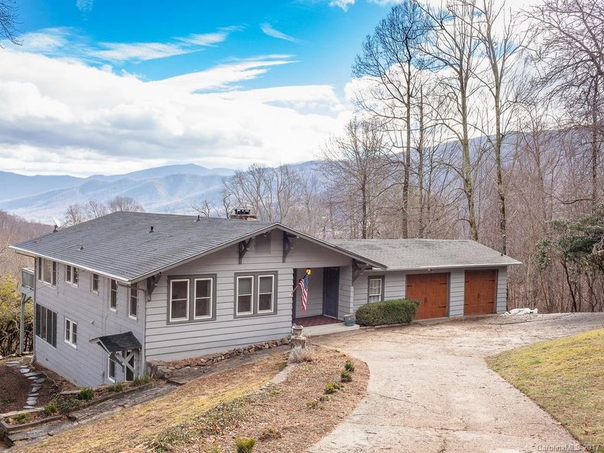 Full-time or 2nd home or vacation rental--show me the money! This updated cottage offers stunning long range MTN. & year-round VIEWS. Only 10 mins to DT Waynesville or Slyva & 40 min. easy drive to AVL. This MTN paradise has spacious rooms, LRG deck, beautiful stone FP, Hdwd Flrs: Cherry, Maple & Pine, screened porch & 2-car garage w/ wkshop & new doors, tons of storage & updates galore incl. int./ext. paint, new windows & roof, kitchen w/ new appl./tile/granite counters, bathrooms. A must see!