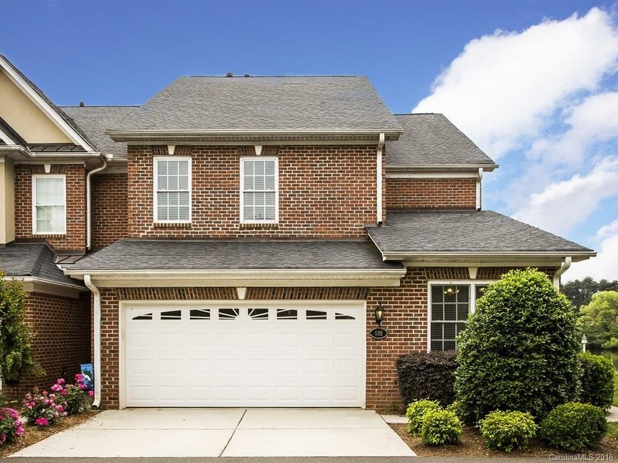 All brick townhome sitting right on the small lake in gated Beacon Knoll Villas, Fort Mill. This is an end unit with 2 car garage, master bedroom on main level, HW floors, exceptional views, freshly painted. Formal dining room, Great room and loft. The setting is very peaceful and tranquil. This is a winner.