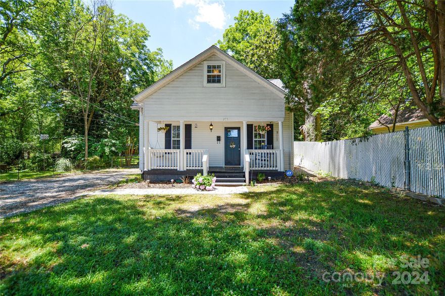 Adorable home with tons of special upgrades!.This  home has been loved and is ready for new owners. Recent updates : The Air Conditioner unit was new in 2022, Water heater in 2023, interior electric box updated in 2022, entry doors in 2024, new roof in 2022, sump pump in crawl space in 2022 and kitchen floors installed in 2021. Come spend your evenings swinging on this spacious front porch or drinking your coffee on the extra large back porch/ deck. From dining area walk upstairs to second floor (that can be closed off if desired) perfect for home office, play room or flex area. Wide plank floors in bedrooms, living room and dining area. Neutral paint throughtout home . Come see today before it is too late !