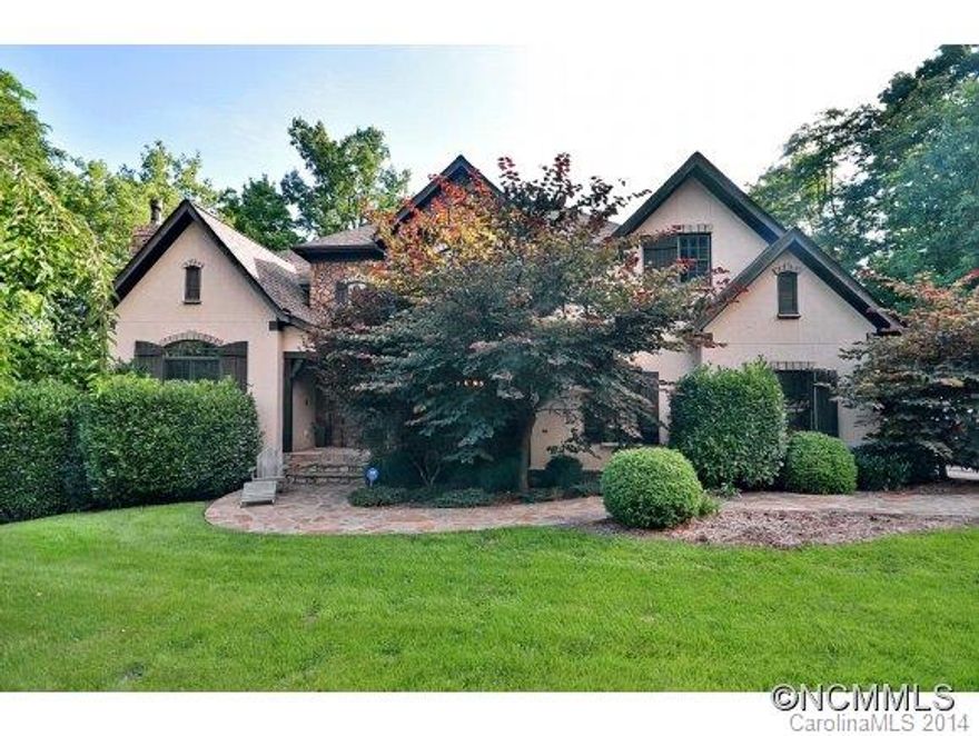 This European French Country home combines the best of old world elegance with comfortable interiors.. Old & new, formal and informal elements are used to create this fabulous Biltmore Lake home in the gated section, Scott's Ridge.  Gourmet kitchen, soaring ceilings,2 fireplaces, large rooms, main level master and office, private backyard with woods& gardens, this home is charming throughout. Enjoy Biltmore Lake amenities including 62 acre lake