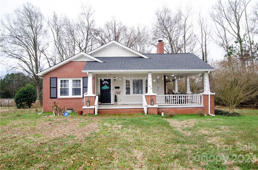 Cute as can be 3 bedroom/2 bath brick bungalow located in the town of York. Fireplace located in the cozy living room, formal dining room and spacious kitchen. Spend your time on the covered wrap around porch and enjoy the private back yard. Newly painted, Vinyl Plank flooring, new roof and water heater.