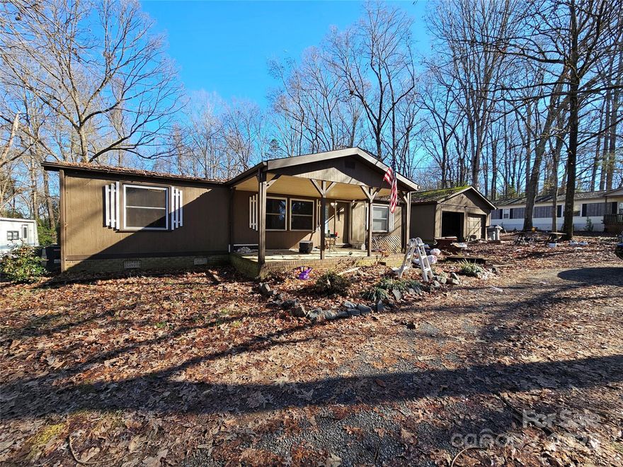 **Great Opportunity to Own a Fixer-Upper in Indian Land** Located on a spacious 1.18-acre lot, this home provides plenty of room for expansion, outdoor activities or future projects. The 1983 manufactured home is in need of repair & ready for a makeover. The property includes a generous sized 722 sqft detached garage offering ample space for vehicles, tools, or hobbies. A covered front porch welcomes you home, while the back covered porch provides the perfect space for enjoying the outdoors. Two storage buildings are also included. Whether you're looking to renovate or rebuild, this home offers the perfect canvas for your vision. Don't miss out on this incredible opportunity to own a piece of Indian Land at an affordable price. Sold As-Is. Cash offers only due to condition. Title has not been retired. Sellers preferred closing attorney is Folks & DeVenny, LLC in Lancaster who handled the previous closing, has title info, etc.