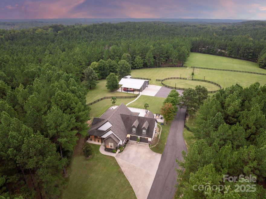 Welcome to this meticulously crafted, custom-built estate on 8 acres of fully fenced pasture, where luxury & sophistication converge in a serene setting. Perfect for car enthusiasts & equestrians, featuring 1,300 sq ft refinished shop & 3 pastures w/ miles of accesible trails. Inside, European White Oak hardwoods flow through the main level, complemented by freshly painted interiors, custom finishes, & stunning light fixtures. The remodeled kitchen showcases marble countertops, a tiled backsplash & SS appliances. The great room features vaulted ceilings & newly added gas fireplace!The primary suite includes spa-like bath w/ a soaking tub, walk-in shower, & dual marble vanities. You'll love the stunning office w/ built-ins + 2 additional spare bedrooms offered! Enjoy a solar-powered gated entrance, Genrac generator, stamped concrete patio w/ a gas fire pit, outdoor kitchen & an in-ground saltwater pool. The 36x36 shop includes a bathroom, paint studio, lift, & outdoor RV & boat storage!