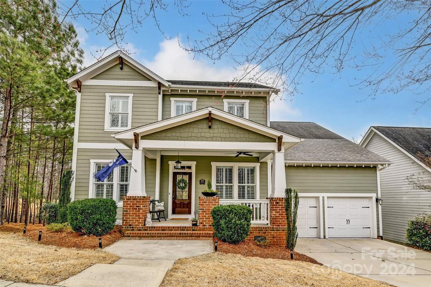 Classic Craftsman Beauty in Baxter Village! With 3,566 square feet, this home offers ample room with 5 bedrooms, 3.5 baths, and a spacious loft. Step in from the welcoming front porch and inside to gleaming hardwood floors and a chef's kitchen equipped with a gas cooktop and upgraded appliances, perfect for culinary enthusiasts. The interior is elegantly appointed with a gorgeous stone fireplace, built-in features, the primary suite down, and plantation shutters throughout. The open-concept layout is just perfect for gathering. The screened porch offers a tranquil retreat to enjoy sunsets and serene wooded viewsI Tons of storage space, including an impressive 12ft+ crawlspace that presents opportunities for further customization. Hop on the Baxter Trail system just behind the home, which provides a scenic route to the picturesque Catawba River. This Classic Craftsman home offers a blend of elegance, comfort, and convenience, making it the perfect place to call home in Baxter Village!