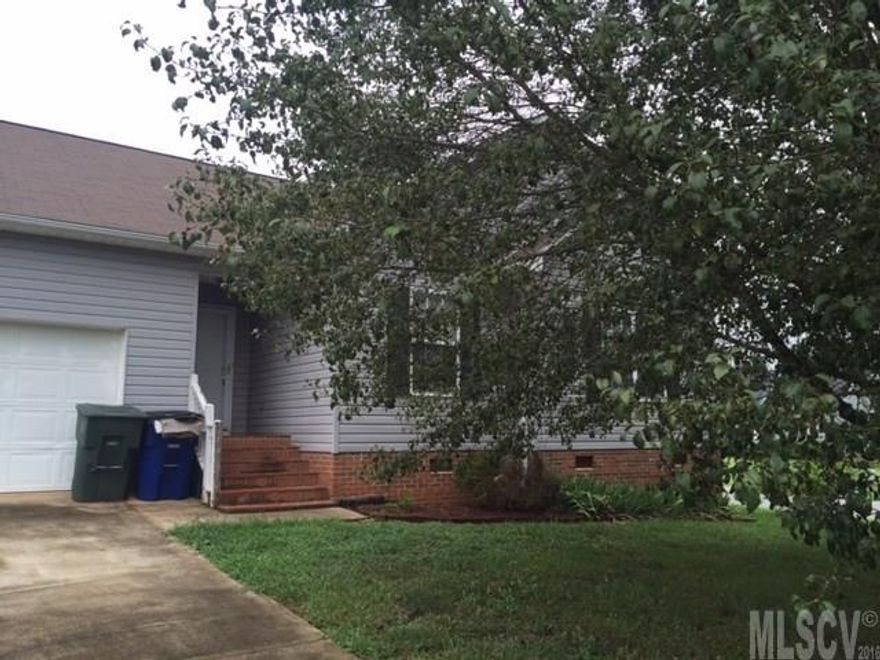 3 bedroom 2 bath home between Hickory and Conover.  All one level.  2 car garage.  Large rooms and open floor plan.  Large deck at the rear of the home overlooks the back yard.  Mature trees in front yard.  The living room is open to the kitchen dining area.  Great home for first time buyer.  This property is being sold in as is condition.  Seller to make no repairs.