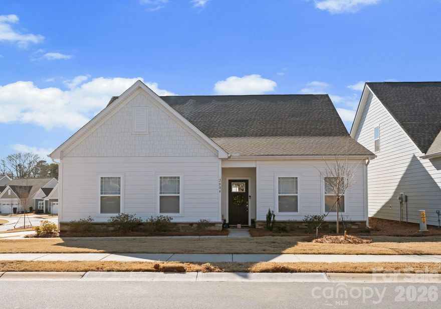 Welcome home to this stunning ranch on a corner lot, built in 2023. Ideally located in a desirable 55+ community and just minutes from Main Street Fort Mill! Enjoy a vibrant lifestyle surrounded by Fort Mill Golf Club, dining, shopping, parks, and everyday conveniences. This thoughtfully designed 2-bedroom, 2-bath home also features a spacious office ideal for working from home or flexible living space that can adapt to your lifestyle. Luxury vinyl plank flooring flows throughout the open-concept living space, highlighting the gourmet kitchen with quartz countertops, a large island, and stainless steel appliances. The living space is seamlessly connected to a covered back patio, making this layout ideal for entertaining or relaxing outdoors. The spacious primary suite offers a walk-in closet and an ensuite bath with a tiled shower and double vanity. This home is a perfect blend of modern comfort, low-maintenance living, and an unbeatable location—ready to be enjoyed in every season!