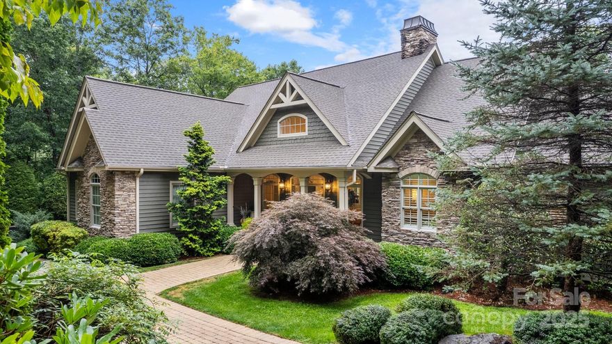 So close…..yet so far away!.......this custom Arts and Crafts masterpiece is only 15 minutes from Main Street in Hendersonville….and, as part of the gated community of Oleta Falls, the setting is  like a national park.  The community encompasses over 400 plus acres of Blue Ridge terra firma (200 of which is unspoiled common area, with numerous wooded trails, a beautiful 40 foot waterfall, incredible mountain views, the Little Hungry River, and a community  clubhouse, pool, and fitness center).   This 4BR/3.5BA home features an open floor plan with vaulted ceilings, abundant natural light,  two stacked stone fireplaces, a chef’s kitchen, two primary en-suites (radiant heat in main level primary bath), and multiple areas for alfresco entertaining. The owners have meticulously maintained the home which is in “move-in” condition.  Few homes built today enjoy this level of craftsmanship.  See attachments for floorplans and features. Professionally landscaped.