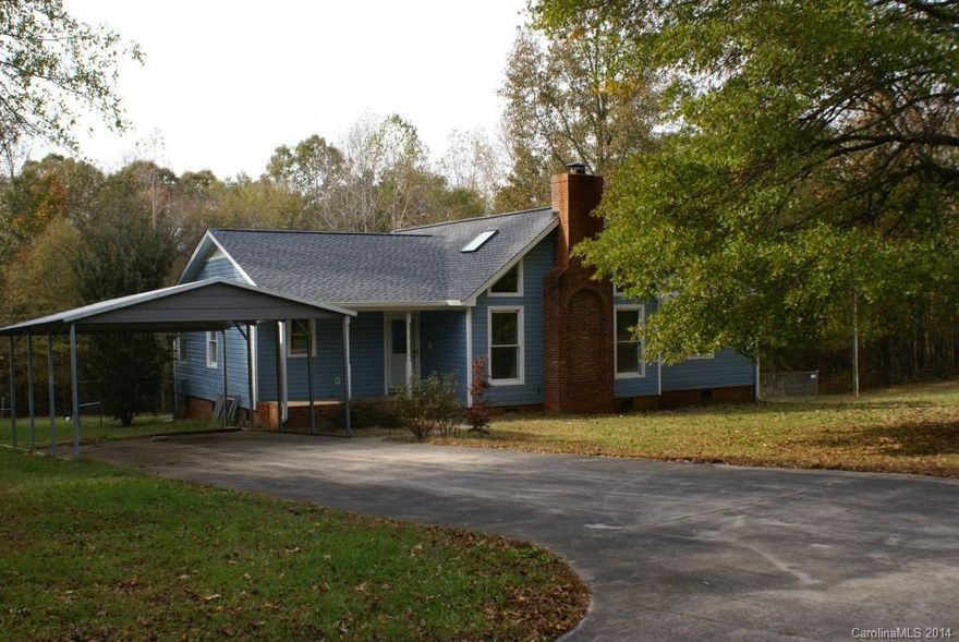 Peaceful private country home with 3 bedrooms and 2 bathrooms on just under 2 acres of land. Large fenced in backyard with a large deck. Large wood burning brick fireplace in the spacious great room with vaulted ceilings with skylights. Brand new carpet in all bedrooms, new siding and gutters. Large kitchen with island and an abundance of cabinets. Recent new roof with architectural shingles. Carport for 2 on a concrete driveway and storage shed. Central location to Charlotte Gastonia,Lake Wylie
