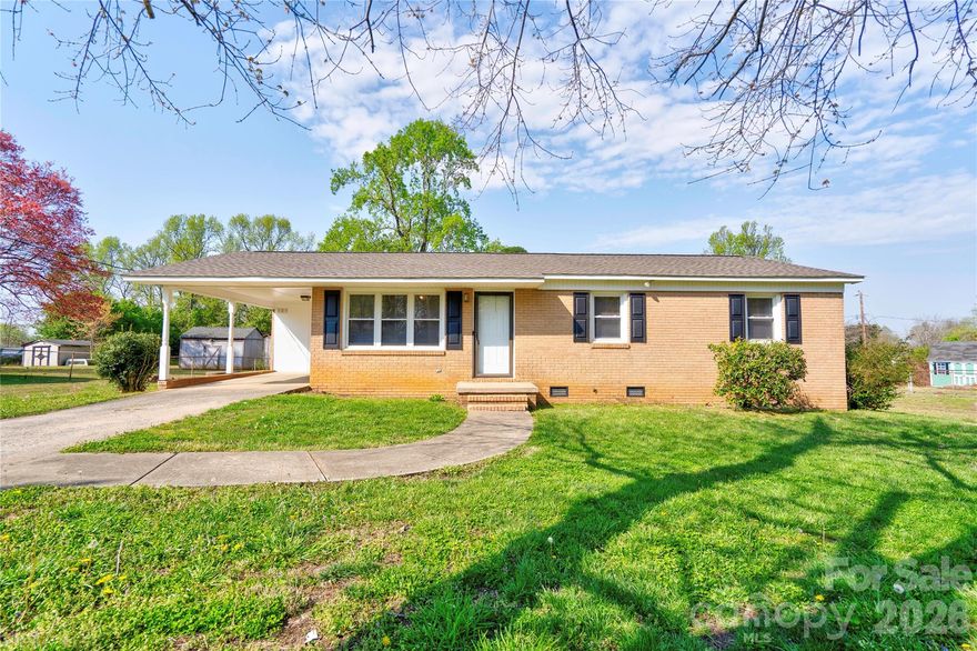 Charming brick 3-bedroom, 1-bath home offering comfort and convenience in a functional layout. This home features a living room that flows into the dining and kitchen, creating an easy space for everyday living. Enjoy the benefits of replacement vinyl windows with low-maintenance aluminum trim. Outside, you’ll find a single carport with an attached laundry/storage room, along with extra concrete parking for additional vehicles. A great opportunity for homeowners or investors alike!