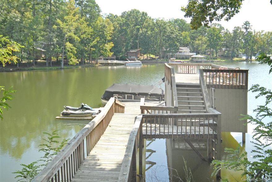 Enjoy the privacy, amazing views & everything else this charming Waterfront home has to offer. Outdoor spaces make this the perfect place for relaxing and entertaining. Stone patio with built-in grill, screened porch, large deck, sun deck over enclosed boat slip. Inside you'll find a family room w/fireplace & a view, large sun room, updated kitchen. Roof, windows, well pump, carpet, sunroom flooring, water heater, HVAC, deck, porch... all recently added, replaced &/or updated. Clover Schools