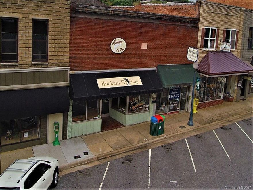 Sylva, NC City Limits (Main St). Commercial building. Main St Level formerly Hookers Fly Shop. Basement currently rented to two separate businesses. Great Income Investment. Property being sold "as is". Seller makes no representation other than clear title.