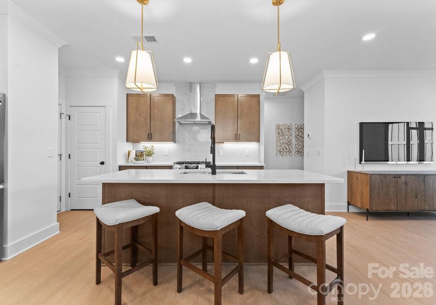 CITY LIVING WITHOUT THE PRICE TAG! Don’t miss this opportunity to live in Enderly Park - one of Charlottes most historic and fastest growing communities! Welcome to The Grayson - a stylish, two-story townhome located in Enderly Park's newest 38-home community, located just minutes from Uptown Charlotte! This thoughtfully designed home features an open-concept layout with a sleek, modern kitchen complete with quartz countertops, a spacious island featuring a built-in Sharpe microwave, soft-close shaker style cabinets, gas range and stylish designer lighting.. Upstairs, you'll find three bedrooms, three full bathrooms and a versatile loft space. The primary suite includes plush carpeting, a walk-in closet, and en-suite bath with a double vanity and floor-to-ceiling tiled shower. Enjoy the convenience of a rare two-car wide garage and relax on your covered back patio! Towne Living at Enderly Park is tucked back giving it it's own neighborhood feel, while being close to everything the west side and Charlotte has to offer! Local restaurants including Noble Smoke, Counter (Charlotte's ONLY Michelin Star Restaurant), Pizza Baby, Bossy Beulah's and more are just minutes away. Traveling is a breeze with the airport less than 10 minutes away! This historic neighborhood has new development around every turn, schedule your showing today!