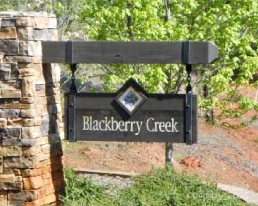 Privacy awaits! This peaceful 3.82-acre wooded lot is tucked away in this quiet gated community, offering the ideal setting to build your dream home surrounded by nature. Enjoy the serenity of a secluded location while staying just minutes from I-40, with easy access to Morganton, Black Mountain, Hickory, and Asheville. Close to wineries, breweries, farmers markets, theaters, and outdoor recreation galore. Outdoor enthusiasts will love the close proximity to Lake James, scenic mountains, and endless hiking trails. Equestrian friendly — bring your horse once your home is built (community requires 1 acre of pasture per animal). Don’t miss this chance to own nearly 4 private acres with easy access to all Western North Carolina has to offer.