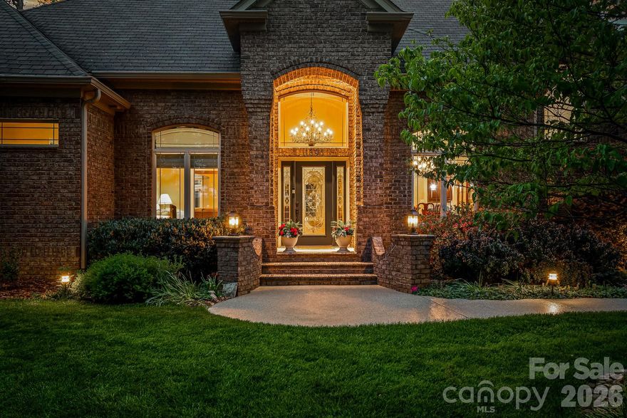 Enjoy lake living at its finest this summer on Lake Norman in this exceptional custom waterfront home! Designed for both luxury and lifestyle, outdoor spaces are truly an entertainer’s dream featuring a covered slip with boat lift and PWC docking, second-level seating area, inground saltwater pool with heated spa, fenced yard, and a screened porch with fireplace overlooking the pool. Gather lakeside around the fire pit and take in the peaceful, private setting. This property truly has it all. Inside, expansive windows throughout the home beautifully frame the water views, complemented by hardwood floors, dedicated home office, custom light fixtures in the dining room and foyer, and stunning coffered ceiling in the great room. A spacious layout includes two additional bedrooms with access to private  full bath and luxurious waterfront primary suite with a tiered, lighted ceiling. The spa-like primary bath offers a separate shower, soaking tub, and a large walk-in closet with built-in drawers. Oversized kitchen and breakfast area flow seamlessly into the great room, all capturing views of the backyard and pool. Highlights include large center island, double ovens, abundant cabinetry, generous counter space, and additional seating. Convenient pool bath with shower is located just off the screened porch. Upper level features a private bedroom with full bath, a walk out balcony offering elevated lake views, and versatile flex space ideal for a gym, teen suite, hobby room, or guest retreat. Additional features include an oversized three car garage with epoxy flooring, ample walk in storage, and a moisture controlled crawlspace. Lake area beneath the dock has been dredged to ensure excellent water depth for year round enjoyment. Situated at the end of a quiet road, this home offers both privacy and tranquility.