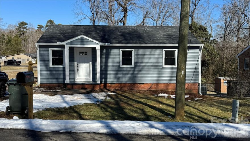 Move-In ready, Beautiful house located at  the city of Lowell with three bedrooms and 2 full bathrooms plus a nice Sunroom. Laminated floors, New roof installed December 2025, New Deck on the back. This house is a few munutes from McAdenville (Christmastown USA) A couple of minutos to Highway I-85 and aproximated 15 minutos to Charlotte. House have some spaces on crawl space that can be used for storage.