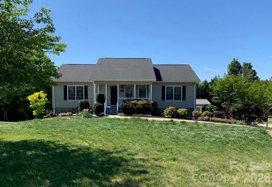 Meticulously maintained 3-bedroom 3 bath home in the Doe Run subdivision of Granite Falls. Main level offers 1,400 heated sq ft with great room, kitchen & dining all featuring beautiful wood floors. Split bedroom plan with primary bedroom & bath right off of kitchen and 2 additional bedrooms & bath off the great room. French doors from dining area led to covered back deck. Basement has 668 heated sq ft with den, office, bonus room and full bath. And you want believe the double garage, it’s as meticulous as the interior of the house.  2 Storage Buildings, 1 very nice outbuilding with double doors. Come sit on the covered front porch and watch the world go by! This home is located
only about 1 mile from NC Wildlife boat access at Lake Rhodhiss.